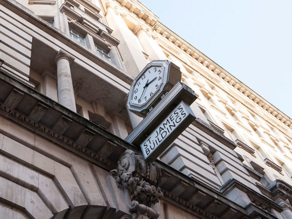 A clock on the outside of St James building